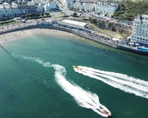 pleasure boats in llandudno next to grand hotel