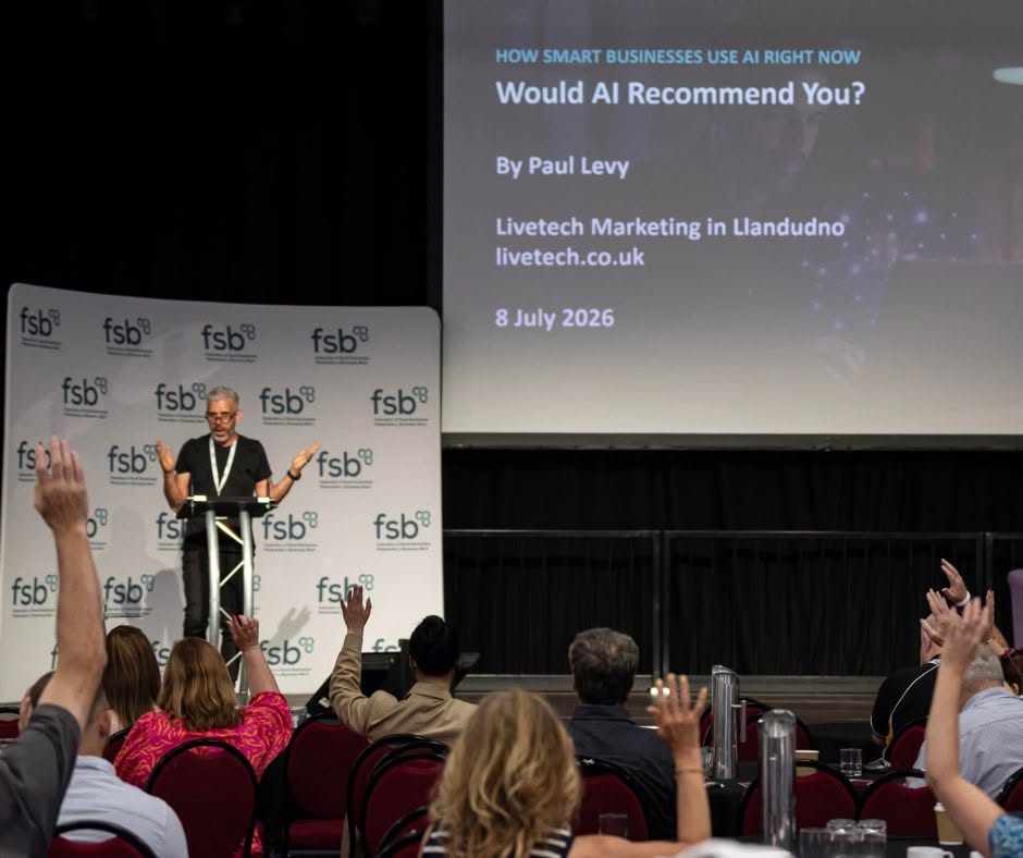 Paul Levy talking at the FSB North Wales Small Business Conference 2026 with a show of hands